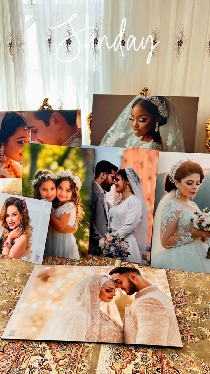 Curated collection of framed bridal and portrait prints arranged on a draped table, showcasing handcrafted photography compositions