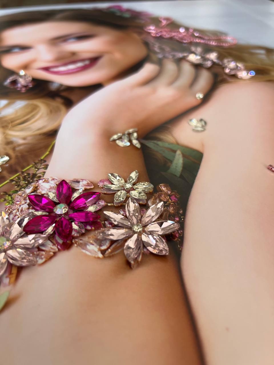 Extreme macro composition of crystal flower brooches arranged as wearable art