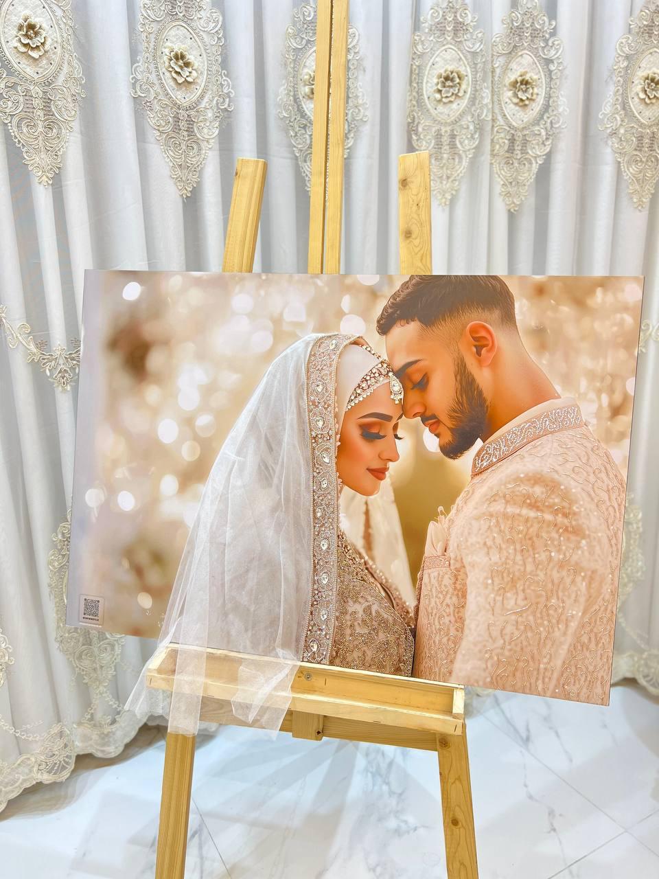 Romantic portrait of a couple in gold-embroidered attire, softly lit with warm bokeh